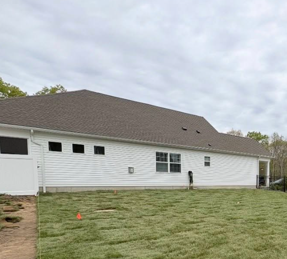 Completed backyard transformation with fresh sod